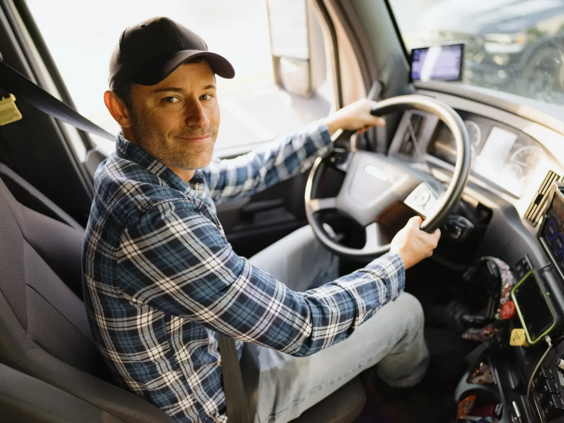 Happy driver inside a truck cab