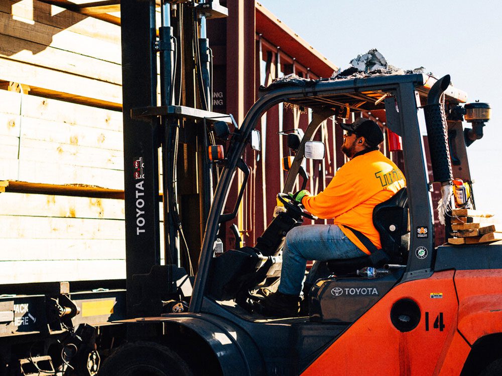 Man operating forklift outdoors