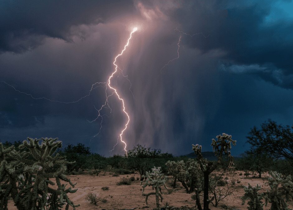 Lightning storm over desert landscape