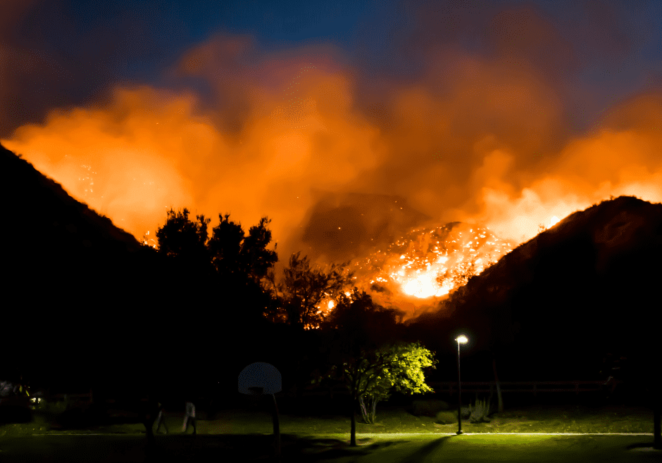 Wildfire burning in the hills at night