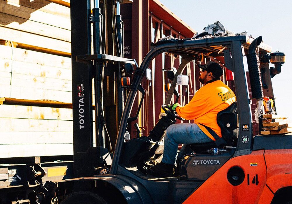 Man operating forklift outdoors