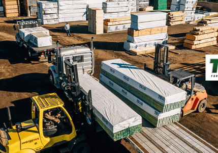 Forklifts moving lumber at Trio Forest Products