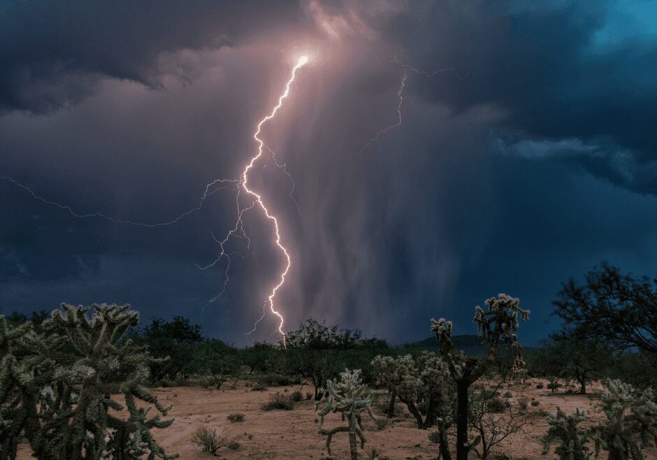 Lightning storm over desert landscape